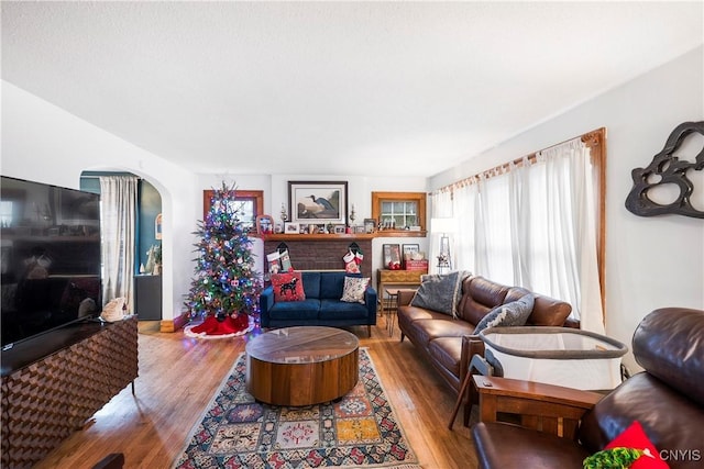 1 Alden Ave, Auburn, NY 13021 - living room featuring arched walkways and wood finished floors