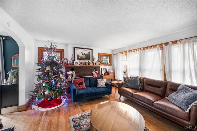 living room with hardwood / wood-style floors and a textured ceiling