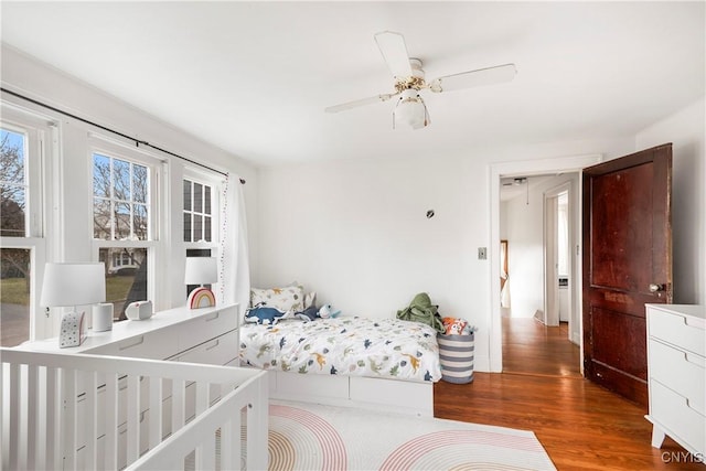 bedroom featuring hardwood / wood-style flooring and ceiling fan