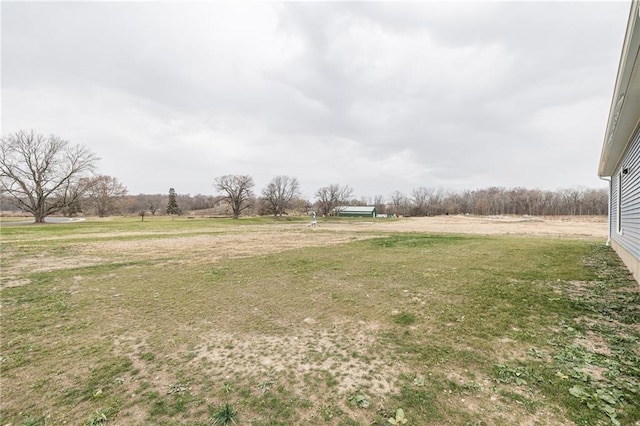 view of yard with a rural view