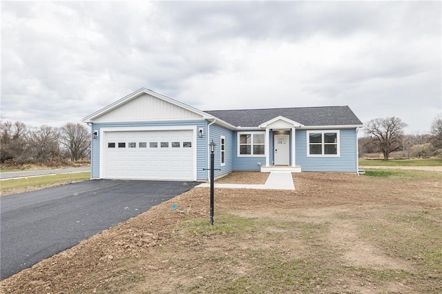 ranch-style house featuring a garage