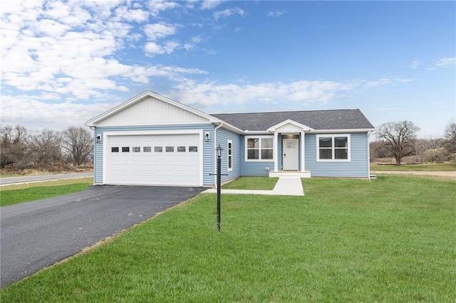 ranch-style home with a garage and a front yard