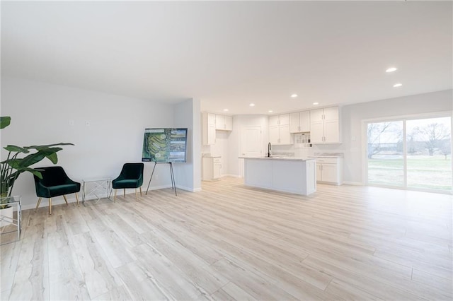 interior space with sink and light hardwood / wood-style floors