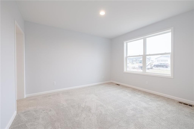 view of carpeted spare room