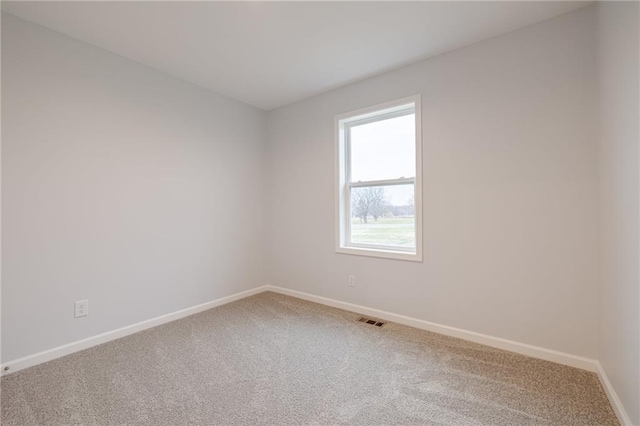 empty room with carpet flooring