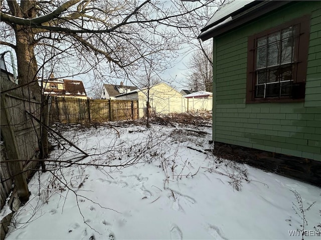 view of yard layered in snow