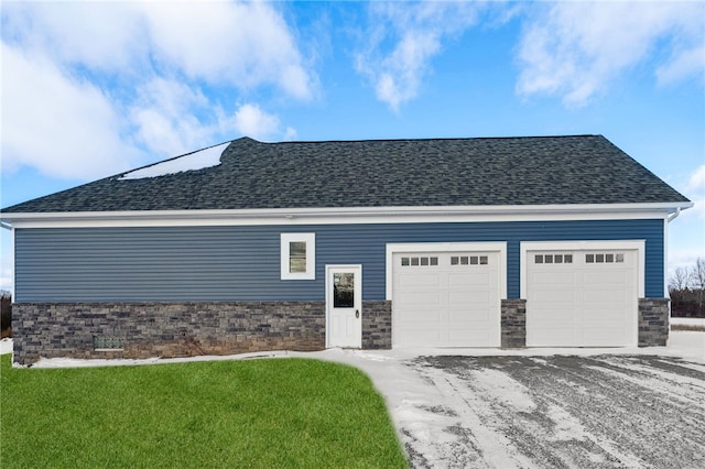 view of property exterior with a yard and a garage