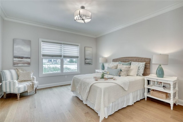 bedroom with crown molding and light wood-type flooring