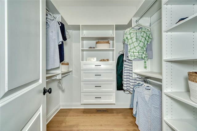 walk in closet featuring light wood-type flooring