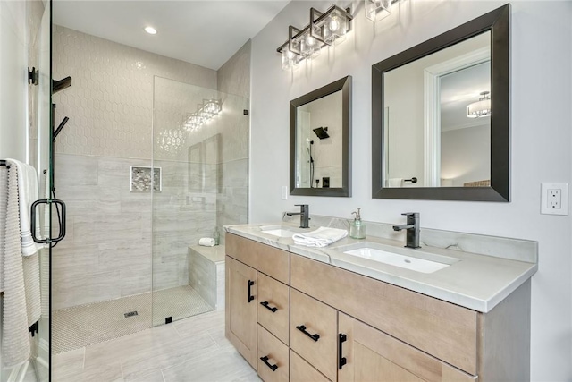 bathroom featuring vanity, tile patterned flooring, and a shower with door