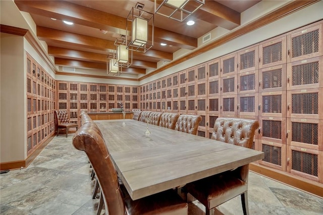 wine area featuring beam ceiling