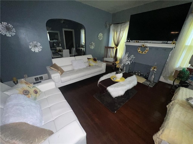 living room featuring dark hardwood / wood-style flooring