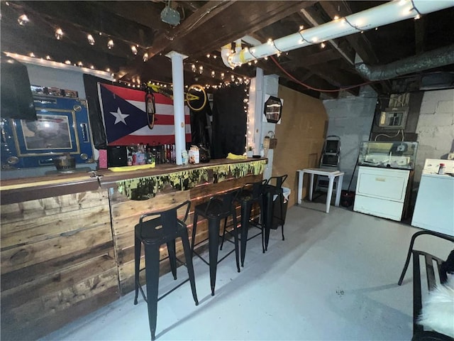 kitchen with separate washer and dryer and concrete floors