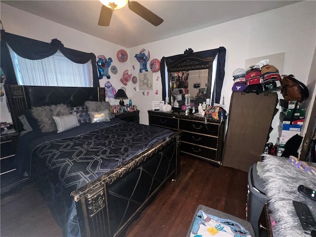 bedroom featuring ceiling fan and dark wood-type flooring