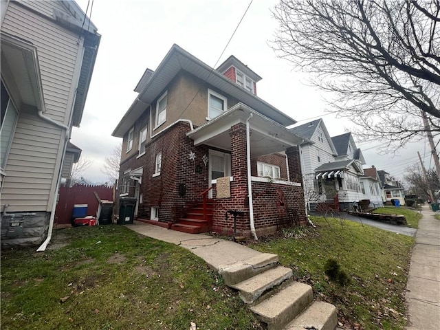 view of side of home featuring a yard