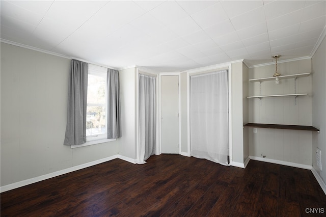 unfurnished bedroom featuring dark hardwood / wood-style floors and ornamental molding