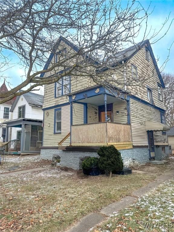 view of property exterior with covered porch