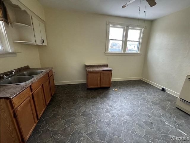 kitchen with ceiling fan and sink