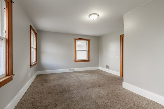 empty room featuring carpet