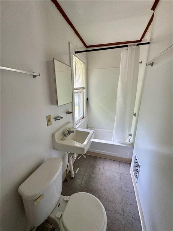 full bathroom with sink, shower / bath combo, and toilet