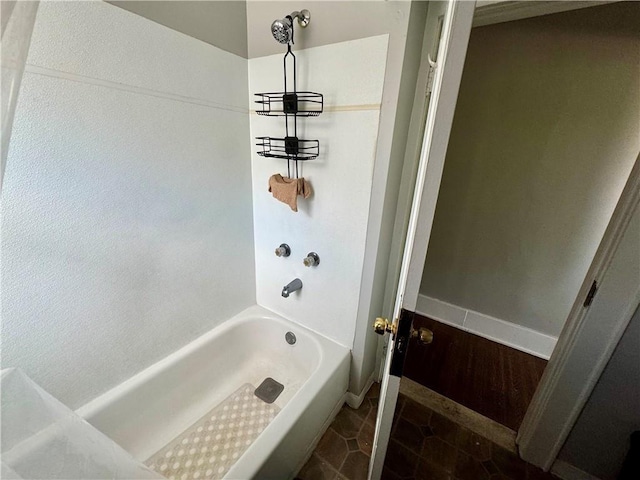 bathroom featuring washtub / shower combination, a chandelier, and tile patterned floors