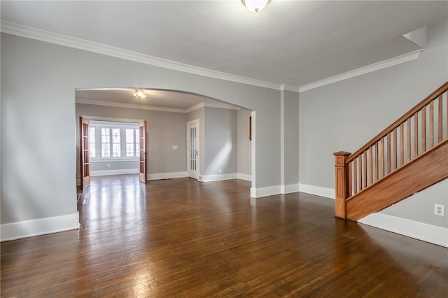 spare room featuring dark hardwood / wood-style floors and ornamental molding