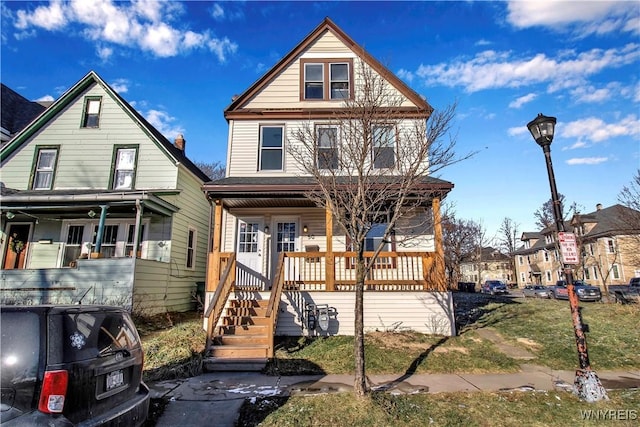 front of property featuring covered porch