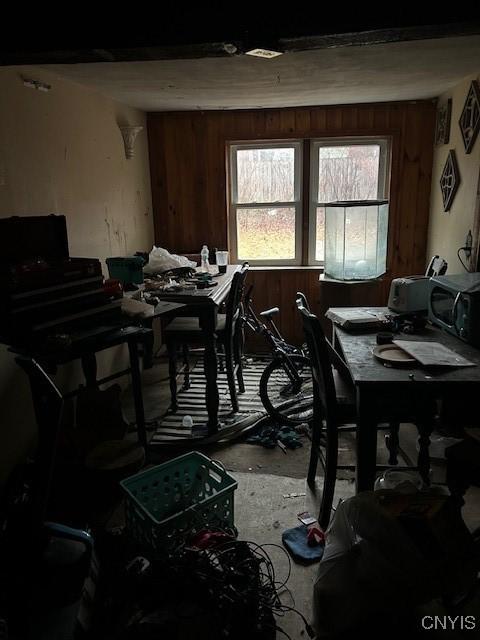 miscellaneous room featuring wood walls