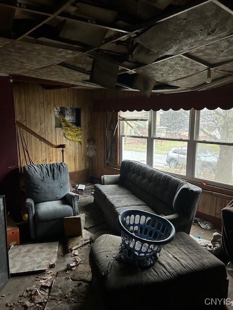 living room featuring wood walls