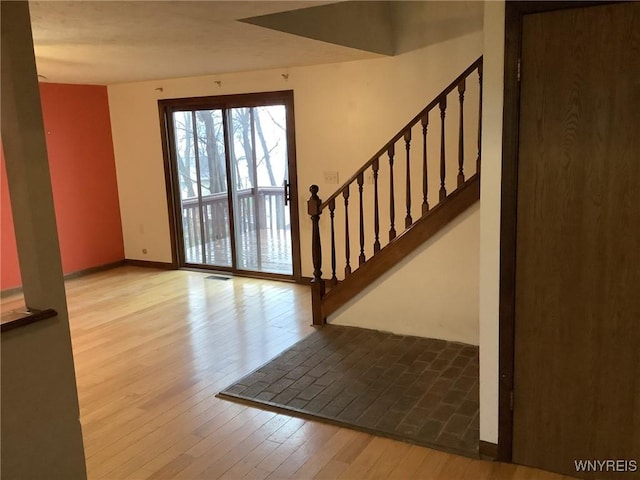 foyer entrance with light hardwood / wood-style flooring