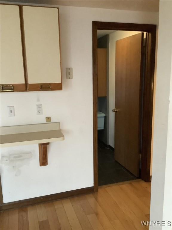 corridor featuring light hardwood / wood-style flooring