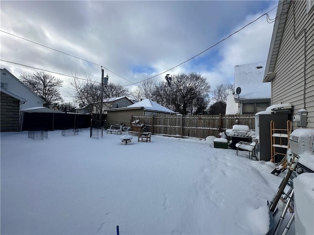 view of yard layered in snow