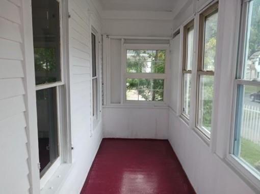 unfurnished sunroom featuring a healthy amount of sunlight