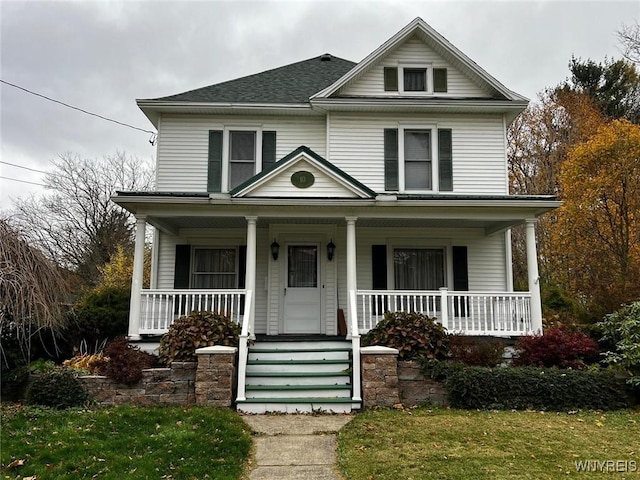 view of front facade with a porch and a front yard