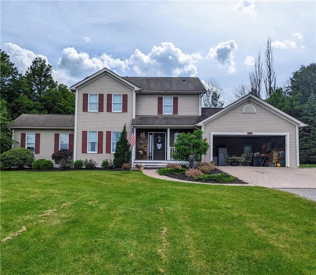 view of front facade with a front yard and a garage