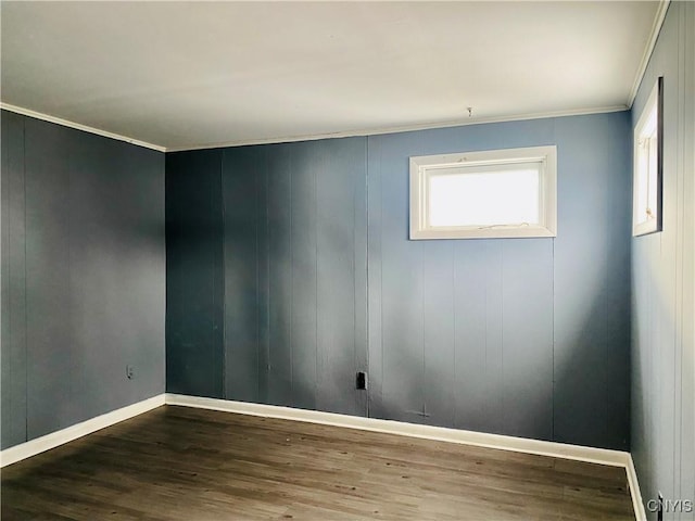 spare room with hardwood / wood-style flooring and ornamental molding