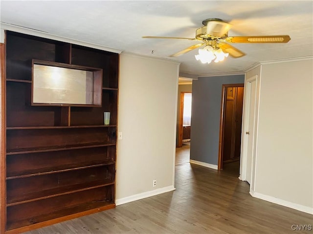 unfurnished living room featuring dark hardwood / wood-style floors, ceiling fan, and ornamental molding