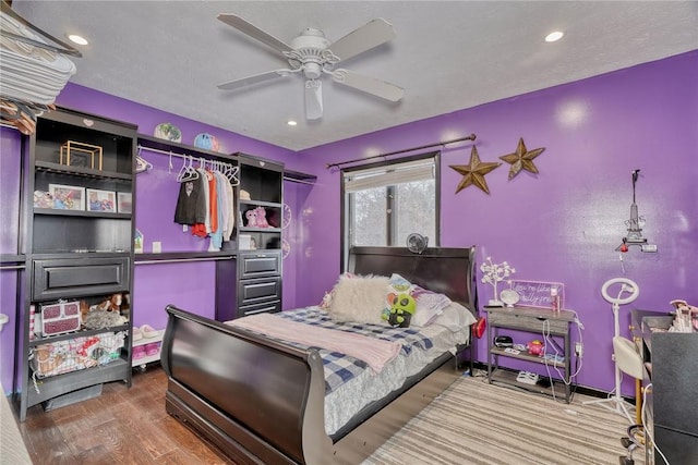 bedroom featuring hardwood / wood-style floors and ceiling fan