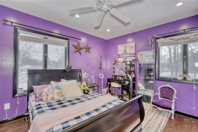 bedroom with ceiling fan and wood-type flooring