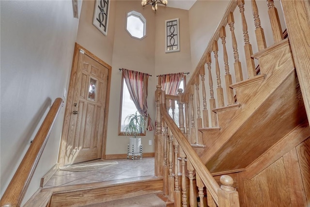 entrance foyer featuring a high ceiling and an inviting chandelier