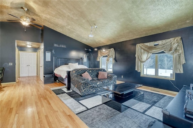 bedroom featuring vaulted ceiling, hardwood / wood-style floors, and ceiling fan