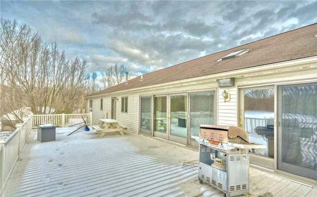 wooden deck with area for grilling