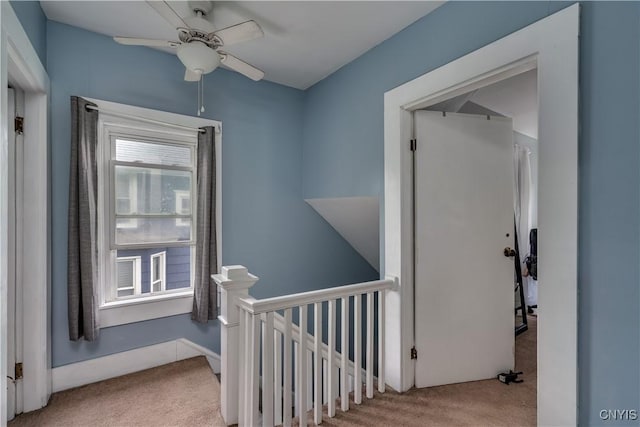 corridor with light colored carpet