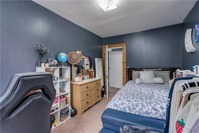 bedroom featuring light colored carpet