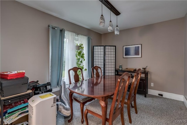 dining area featuring carpet