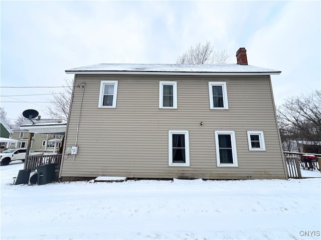 view of snow covered house