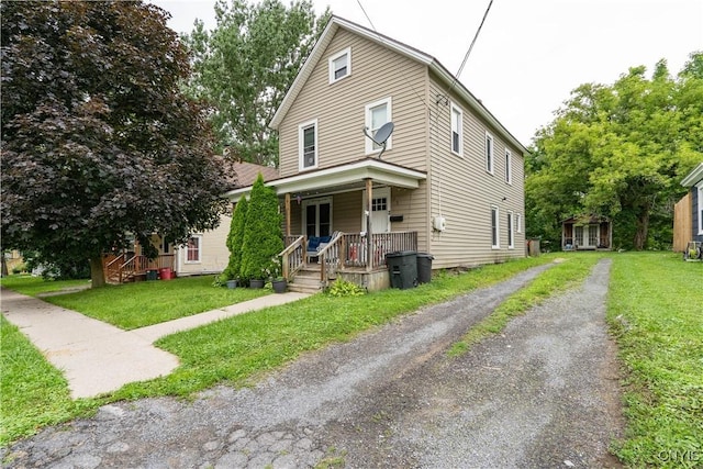 13 Avery Ave, Alexandria, NY 13607 - view of front of property with a porch, driveway, and a front yard