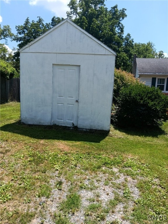 view of outdoor structure featuring a lawn