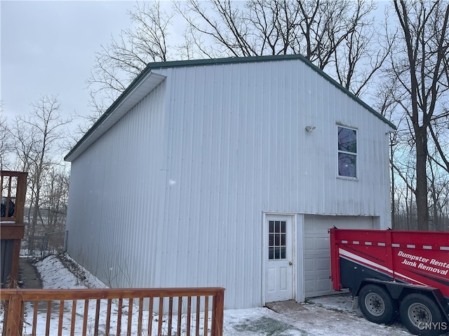 view of side of home with a garage