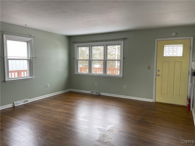 foyer entrance with dark hardwood / wood-style flooring